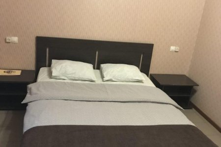 Кровать в номере Стандарт в отеле Волжский бриз