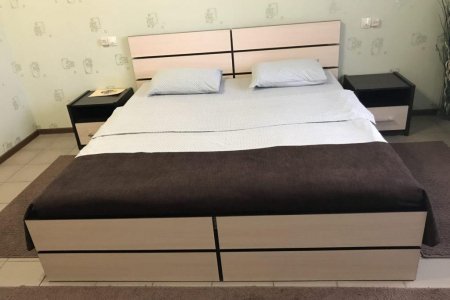 Кровать в номере Стандарт + в отеле Волжский бриз