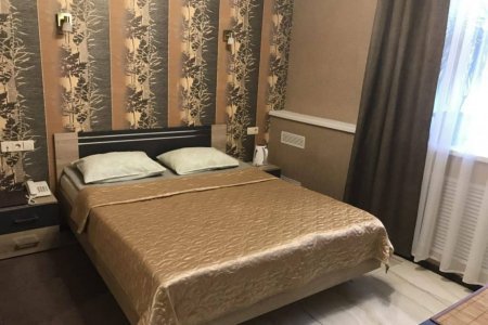 Кровать в номере Стандарт в отеле Мираж