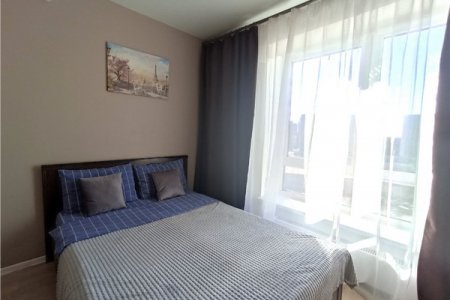 Кровать в номере New studio na Larushina в The LOFT STUDIO Moscow