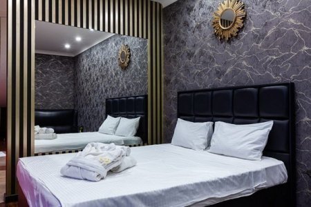 Кровать в номере 20 VIP в De Art на Таганской