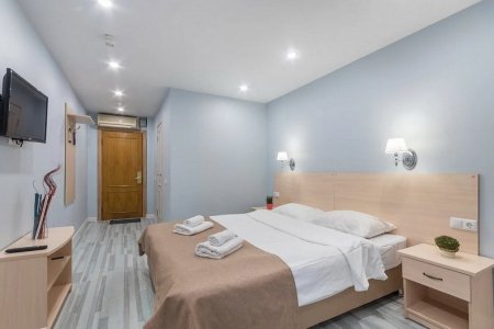 Спальная зона в номере Двухместный комфорт в отеле Новый Восход