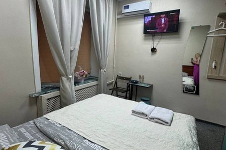 Спальная зона в номере Стандарт в отеле Найс сити