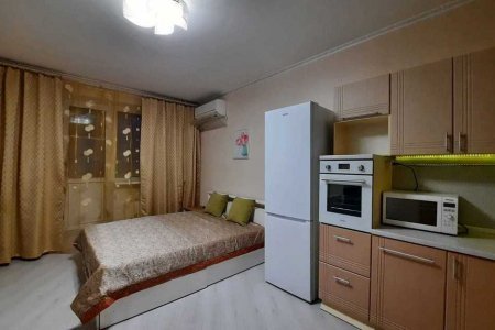 Кровать в апартаментах 3 в Loft Studio