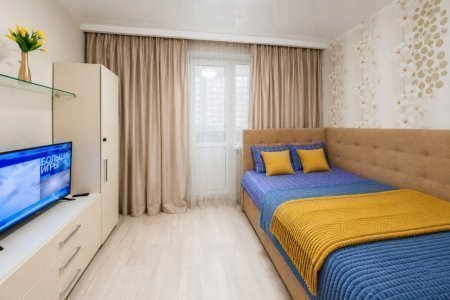 Кровать в апартаментах 4 в Loft Studio
