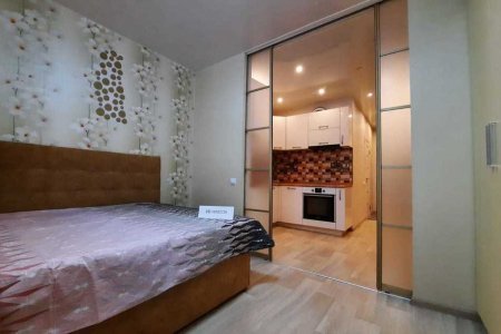 Кровать в апартаментах 4 в Loft Studio