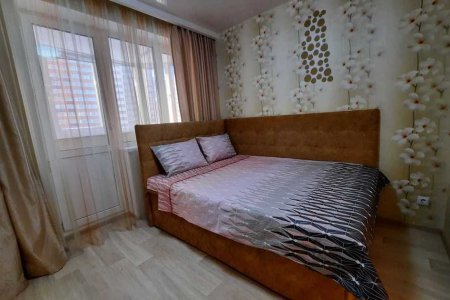 Кровать в апартаментах 4 в Loft Studio