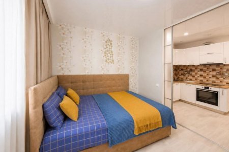 Спальная зона в апартаментах 4 в Loft Studio