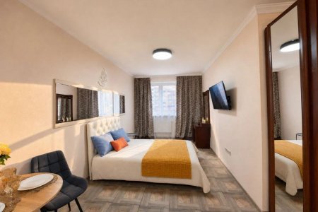 Спальная зона в номере 1 в Loft Studio