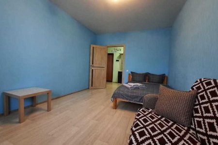 Спальная зона в номере 1 в Loft Studio