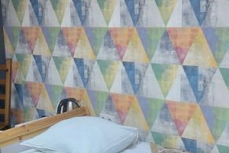 Односпальная кровать в номере Эконом TWIN без окна в Апельсин на Вернадского