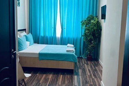 Кровать в номере Делюкс в отеле Баунти