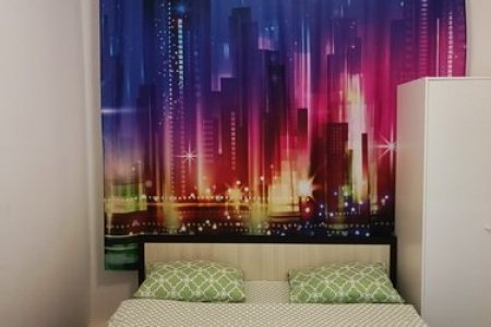 Кровать в апартаментах АромаАпарты