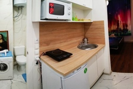 Кухня в апартаментах АромаАпарты