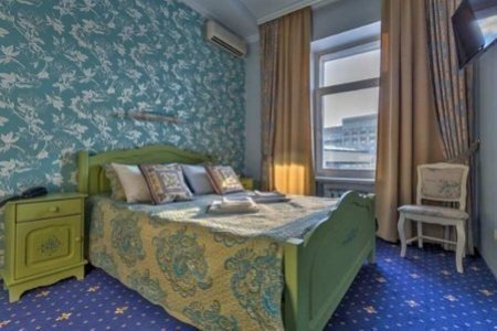 Кровать в номере Стандарт улучшенный в отеле Чистые пруды