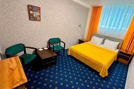 Кровать в номере Стандарт плюс в отеле на Южной