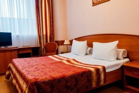 Кровать в номере Стандарт в гостинице на Южной