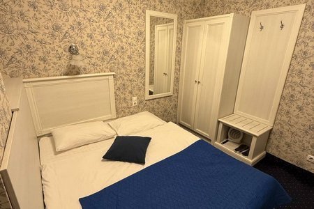 Кровать в номере Стандартный одноместный в отеле Апельсин на Трубной