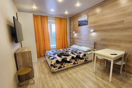 Двуспальная кровать в апартаментах 2 в The Loft Studio у метро Котельники