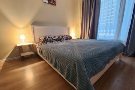 Двуспальная кровать в номере 5 в The Loft Studio у метро Котельники