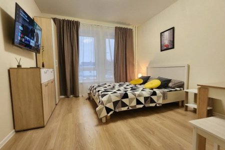 Кровать в апартаментах 1 в The Loft Studio у метро Котельники