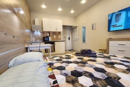 Кровать в апартаментах 2 в The Loft Studio у метро Котельники