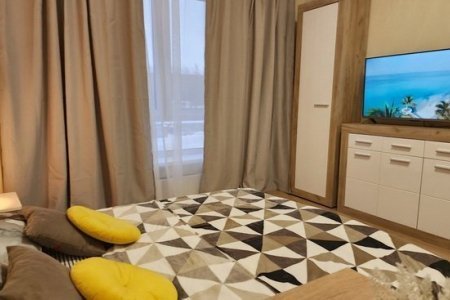 Кровать в номере 3 в The Loft Studio у метро Котельники