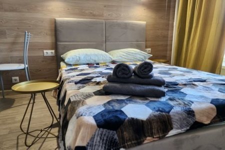 Кровать в номере 4 в The Loft Studio у метро Котельники