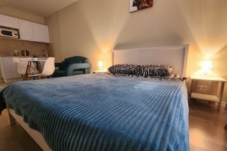 Кровать в номере 5 в The Loft Studio у метро Котельники