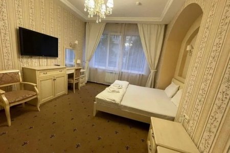 Кровать в номере Комфорт в отеле Автор Люблино