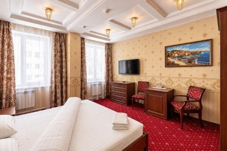 Кровать в номере Комфорт в отеле Автор Люблино