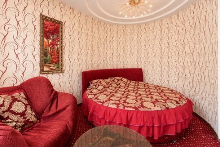 Кровать в номере Люкс в отеле Автор Люблино