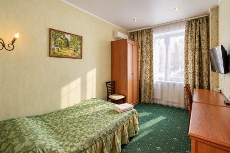 Кровать в номере Стандарт в отеле Автор Люблино