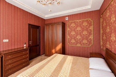Спальная зона в номере Двухкомнатный Люкс в отеле Автор Люблино