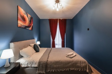 Кровать в номере City Vibe в ЖК Савеловский Сити