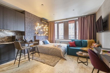 Спальная зона в номере Emerald Suite в ЖК Савеловский Сити