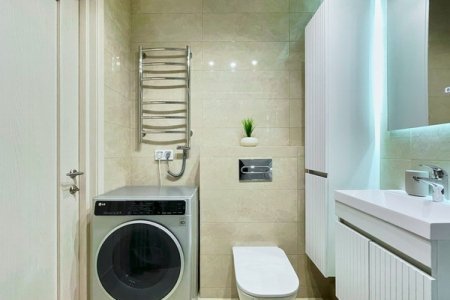 Стиральная машина в номере Breeze Apartments в ЖК Савеловский Сити
