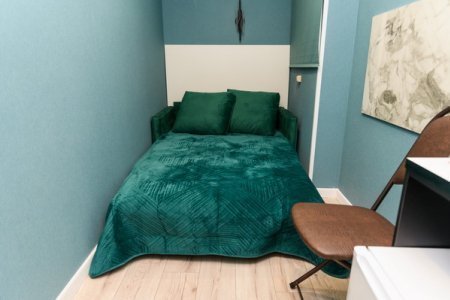 Кровать в номере Эконом в отеле Орфей