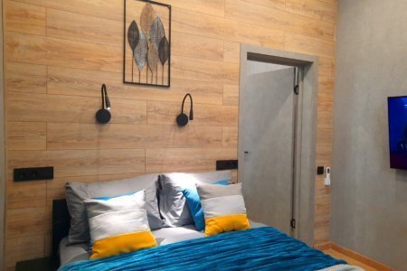 Большая кровать в номере Меркурий в LOFT SPACE