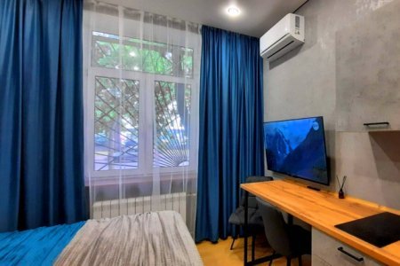 Двуспальная кровать в номере Юпитер в LOFT SPACE