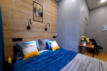 Двуспальная кровать в номере Марс в LOFT SPACE