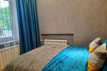 Двуспальная кровать в номере Меркурий в LOFT SPACE