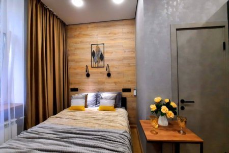 Двуспальная кровать в номере Сатурн в LOFT SPACE