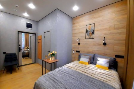 Двуспальная кровать в номере Уран в LOFT SPACE
