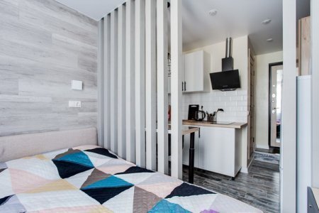 Кровать в квартире 7 в апартаментах Home Like