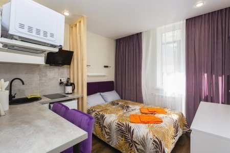 Кровать в квартире 8 в апартаментах Home Like