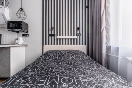 Кровать в номере 18 в апартаментах Home Like