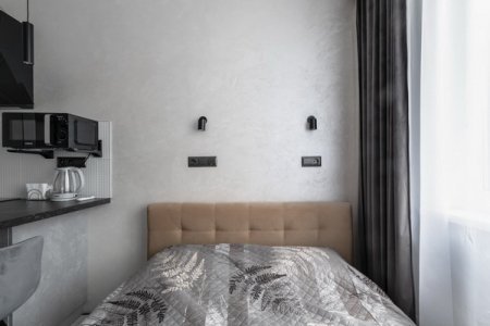 Кровать в студии №20 в апартаментах Home Like