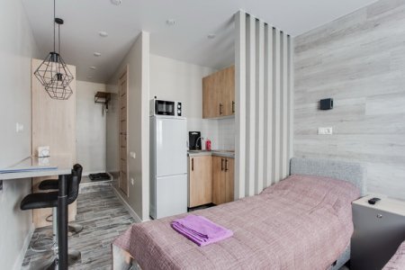 Спальная зона в студии 6 в апартаментах Home Like