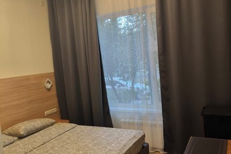 Кровать в номере 10 в отеле Александрия